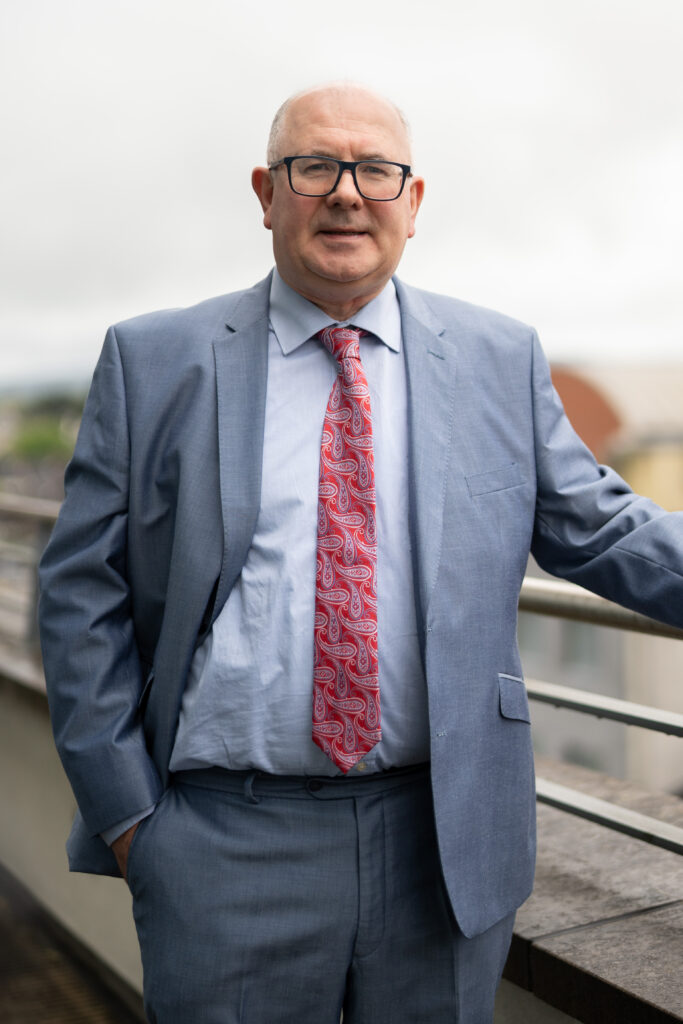 Photograph of William Donovan, Property Law Solicitor standing on a balcony