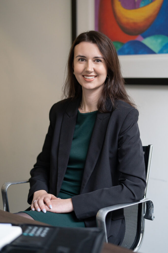 Photograph of Chloe Boland Personal Injury Claims Coordinator sitting at a desk