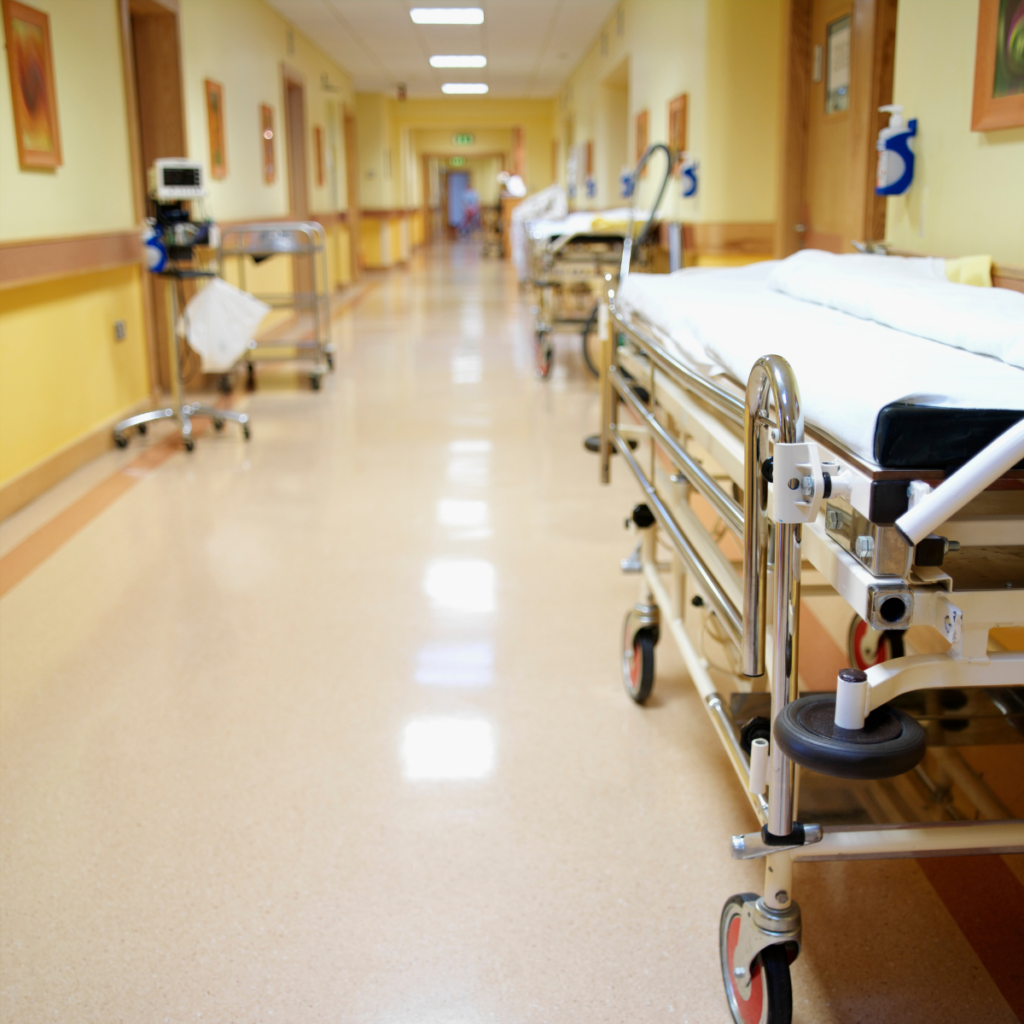 Photograph of an empty trolley in a hospital corridor