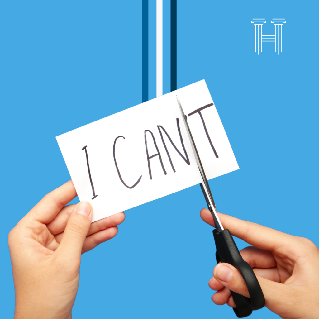 Image of person cutting "T" from the words I Can't