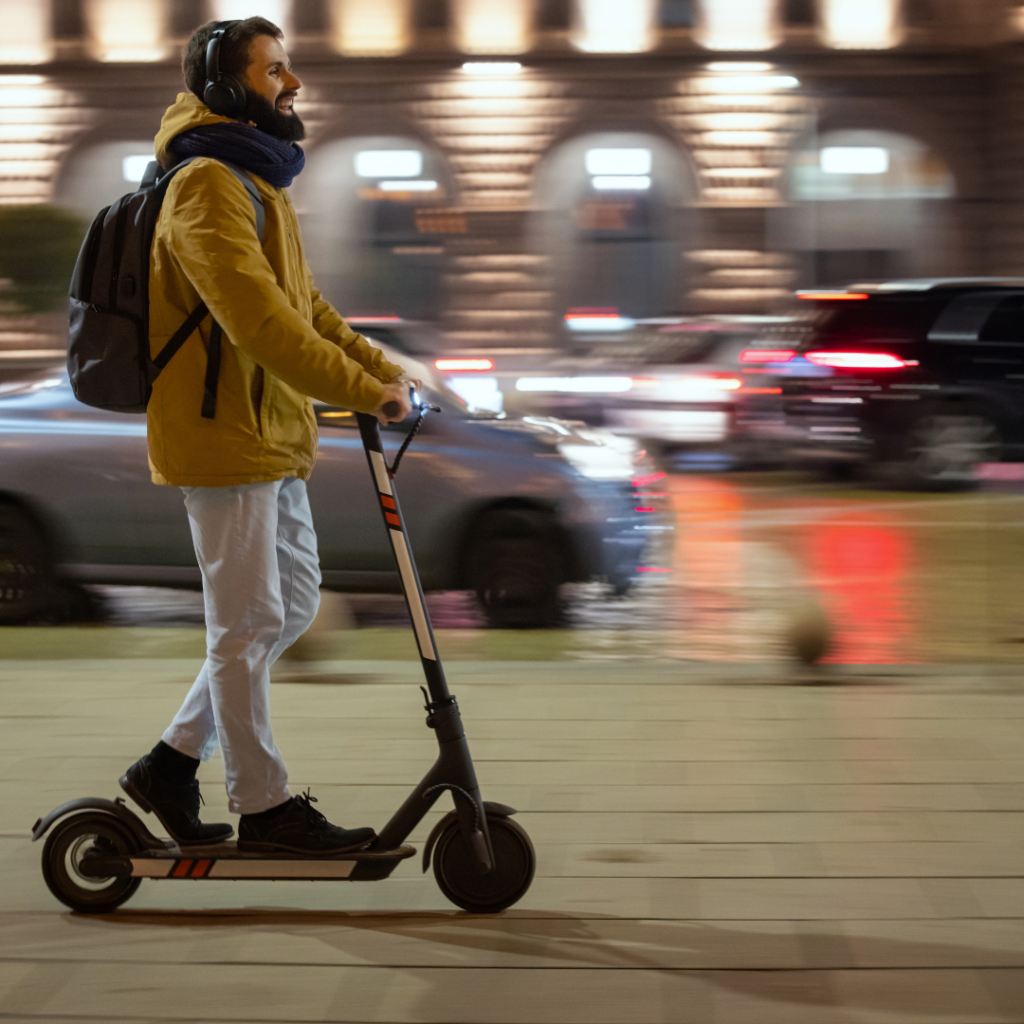 Man Travelling on E-scooter